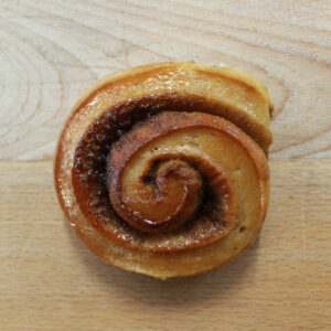 A cardamom bun, a swirl with brown sugar and a light glaze.